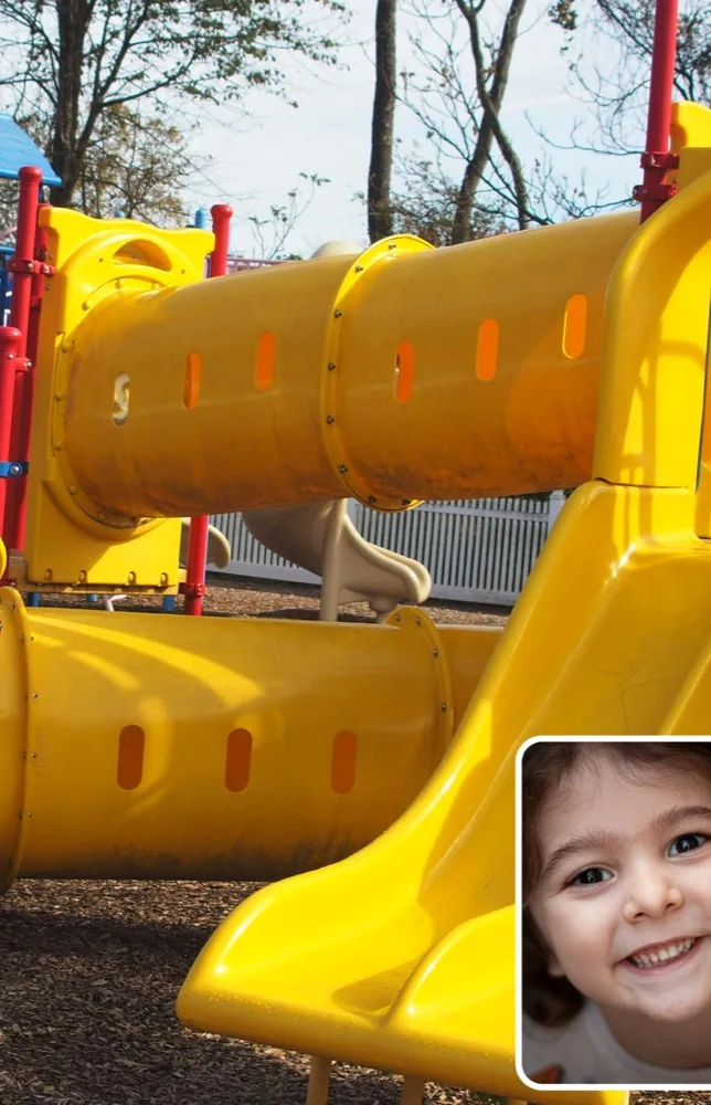 A photo of a yellow slide with the child's face shown small in the bottom-right corner